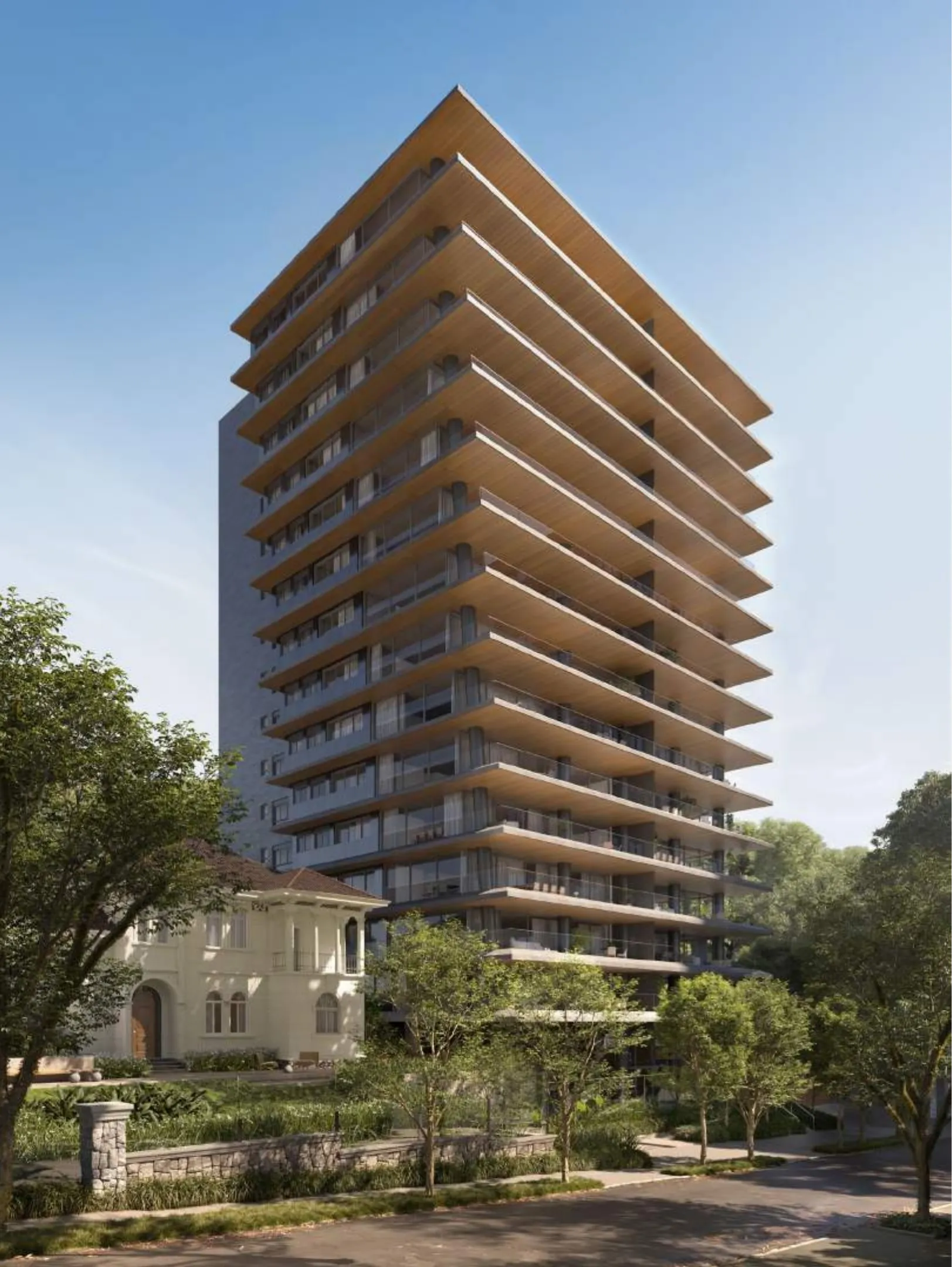 Torre com varandas contínuas e jardins ao lado de casa histórica restaurada, em Moinhos de Vento, Porto Alegre